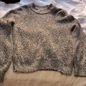 Grey, white and black cable knit sweater